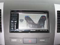 Фотография установки магнитолы Pioneer AVH-P3300BT в Mitsubishi Outlander XL